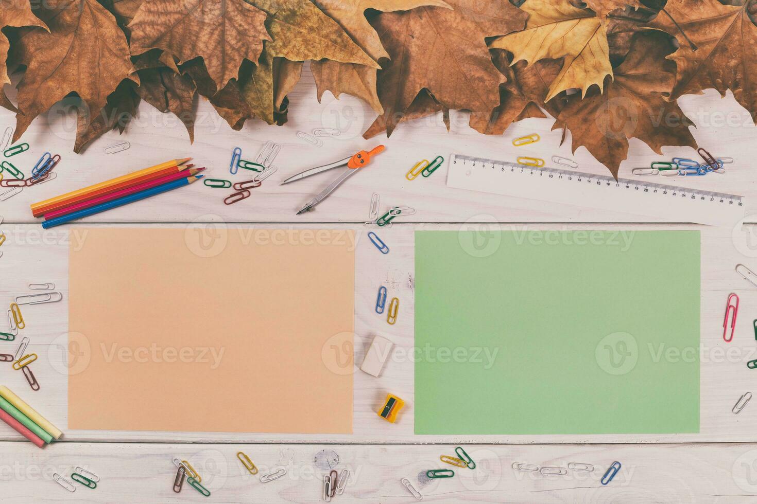 Back to school concept with colorful paper and stationery on wooden table top view photo