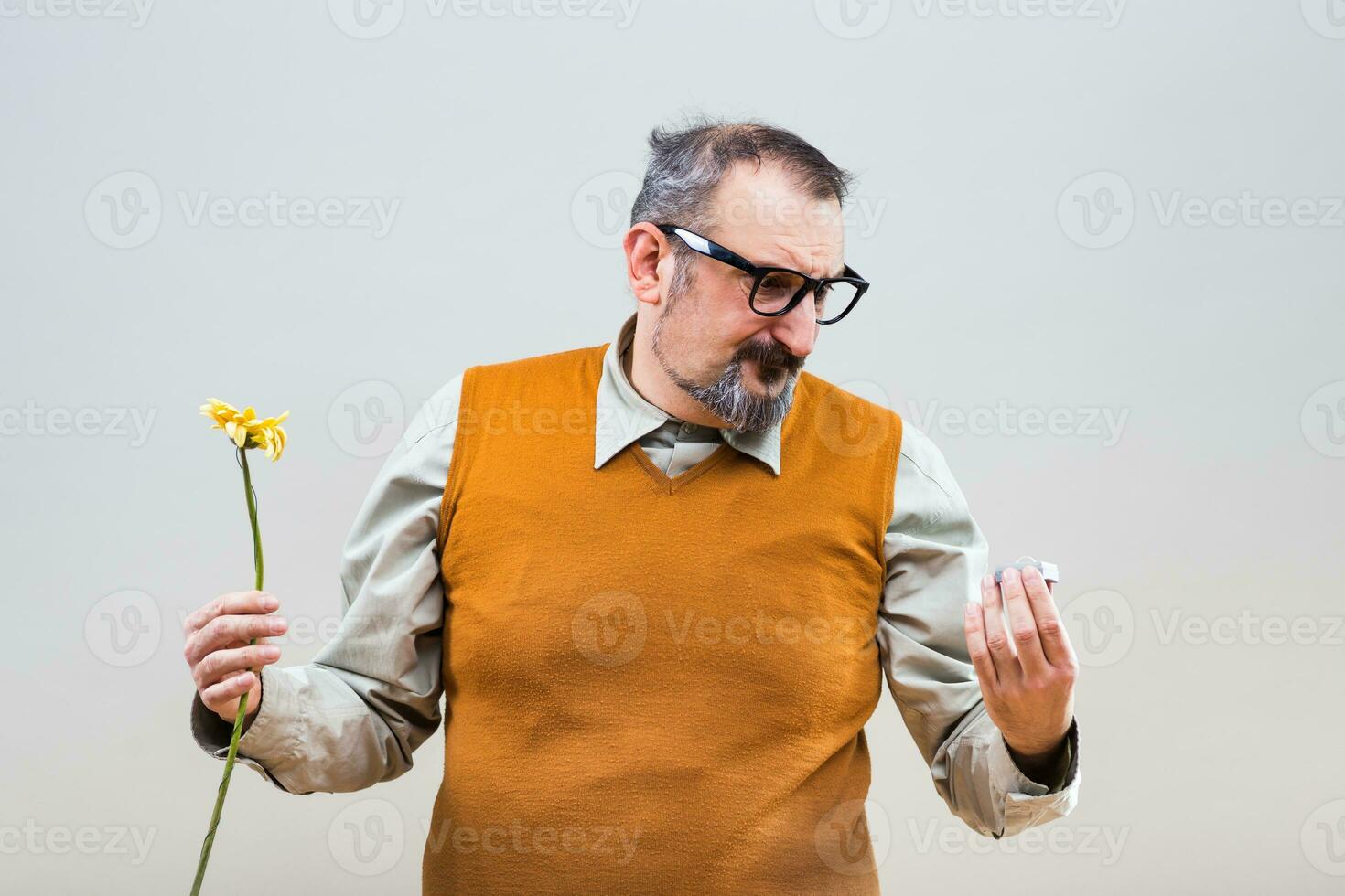 Nerdy man is very sad because he had proposal his girlfriend but she rejected him photo