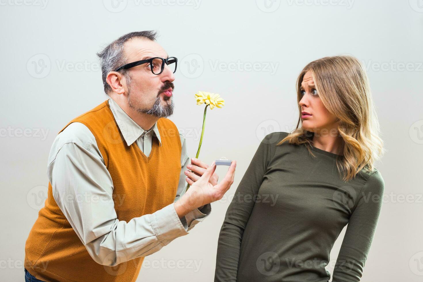 Nerdy man wants to marry to a beautiful woman but she is terrified, she doesn't want to marry photo