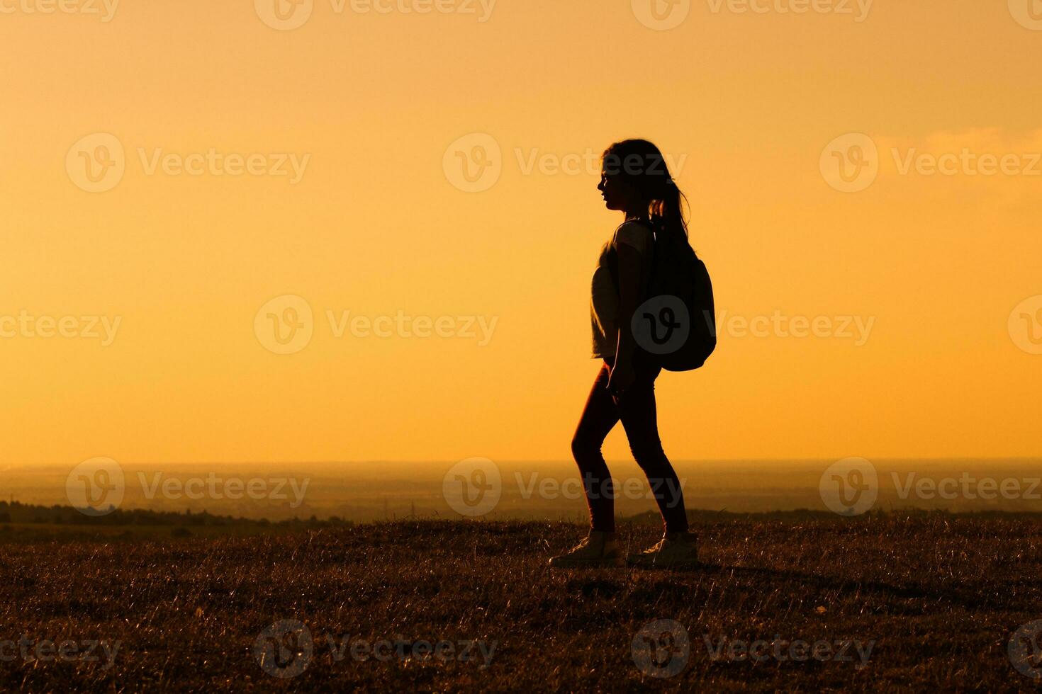 Little girl hiker standing in the nature photo