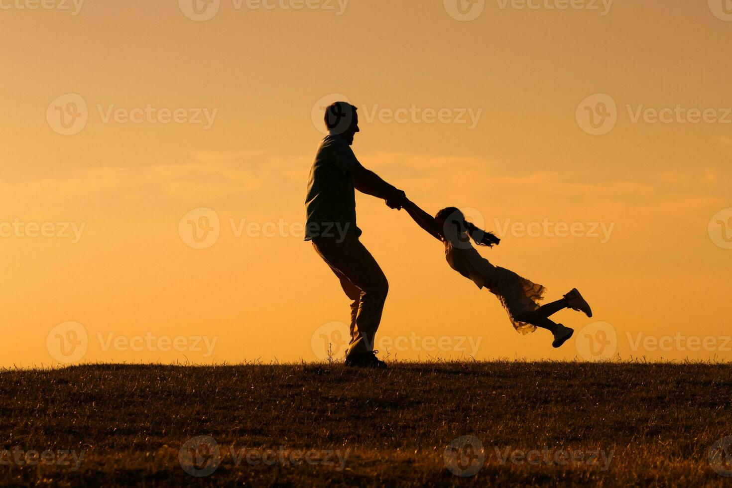 Happy father and daughter having fun in nature photo