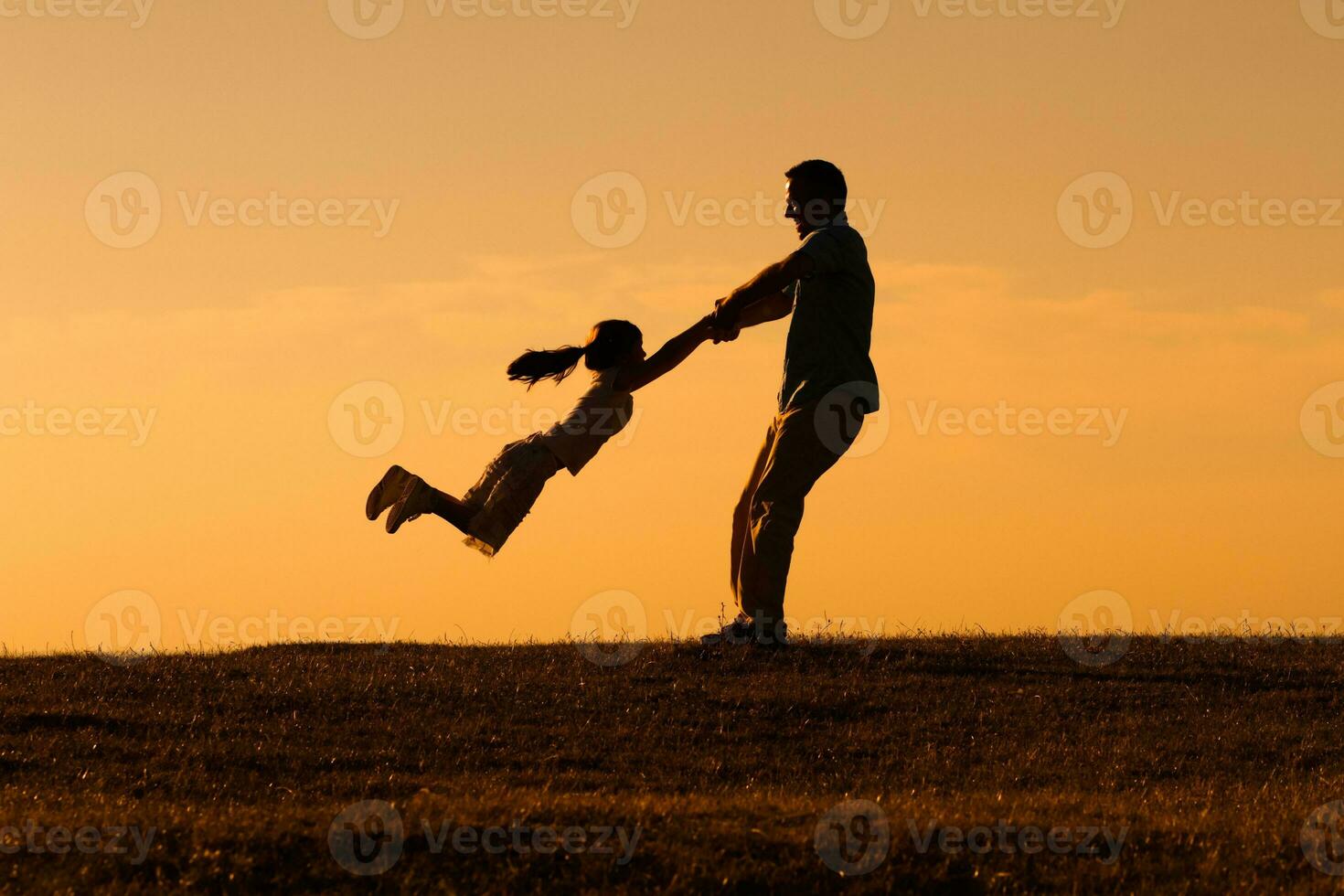 Happy father and daughter having fun in nature photo