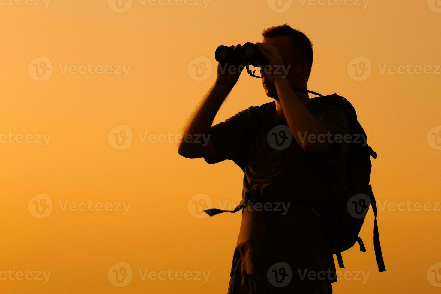 Hiker with binoculars photo