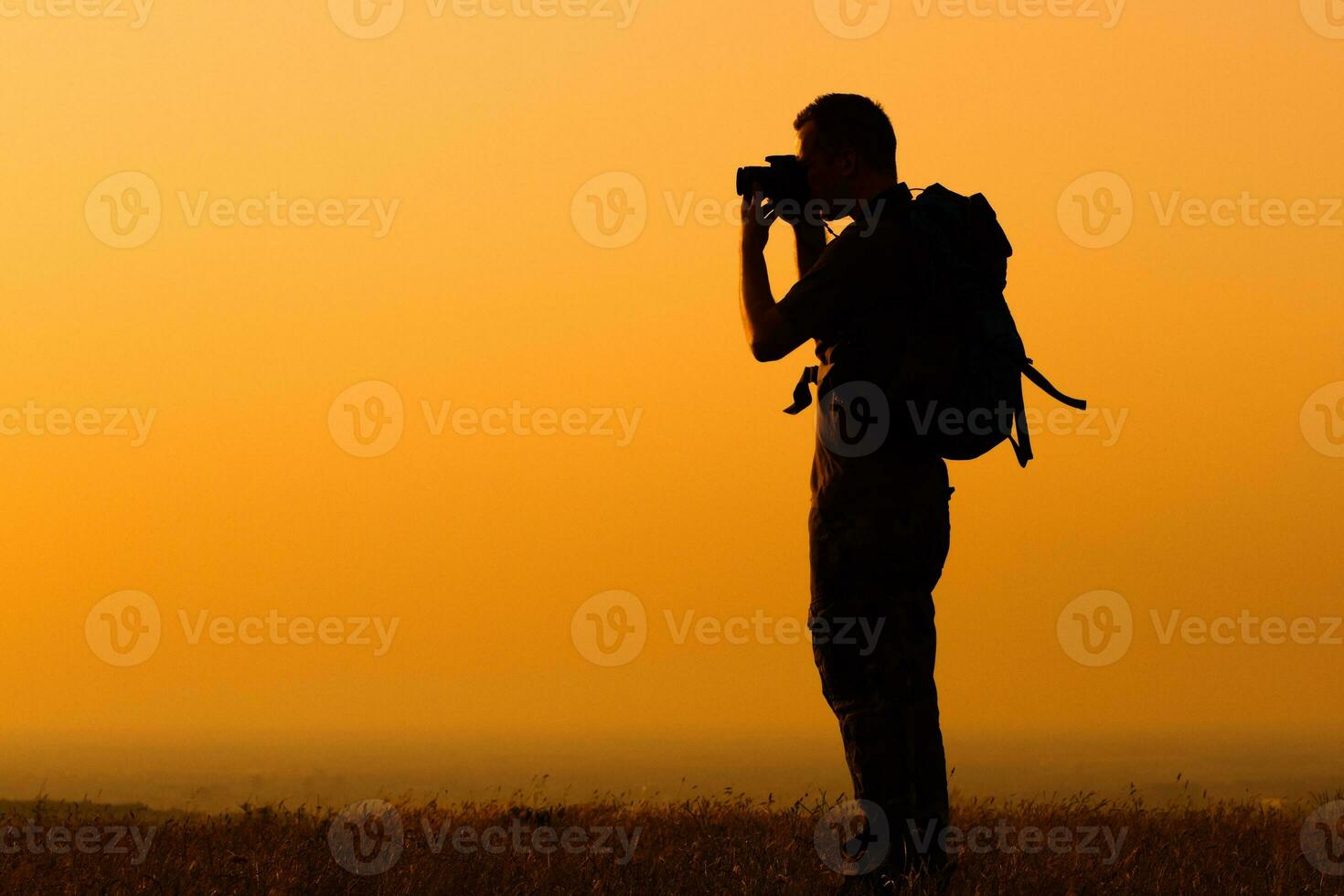 Hiker with binoculars photo