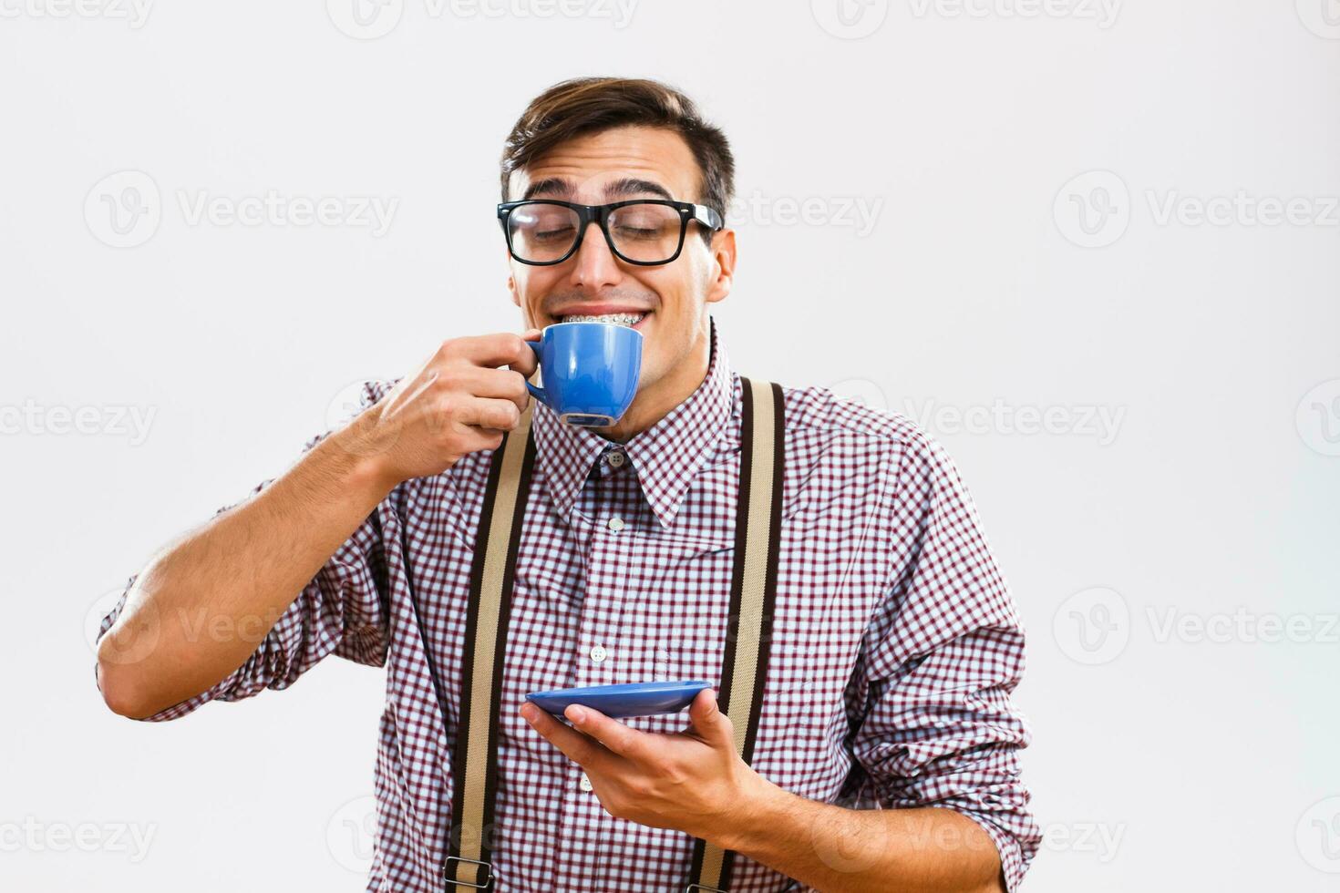 Nerdy man enjoys drinking coffee photo