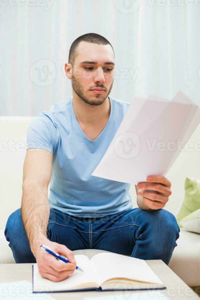 Young businessman working at home photo