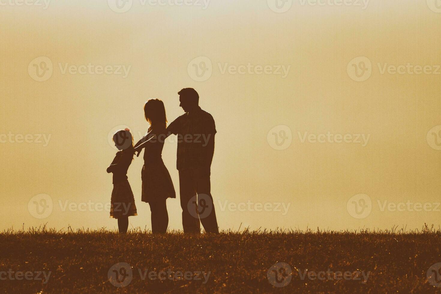 Parents had a conflict with their daughter and now they are consoling her but she is very angry photo