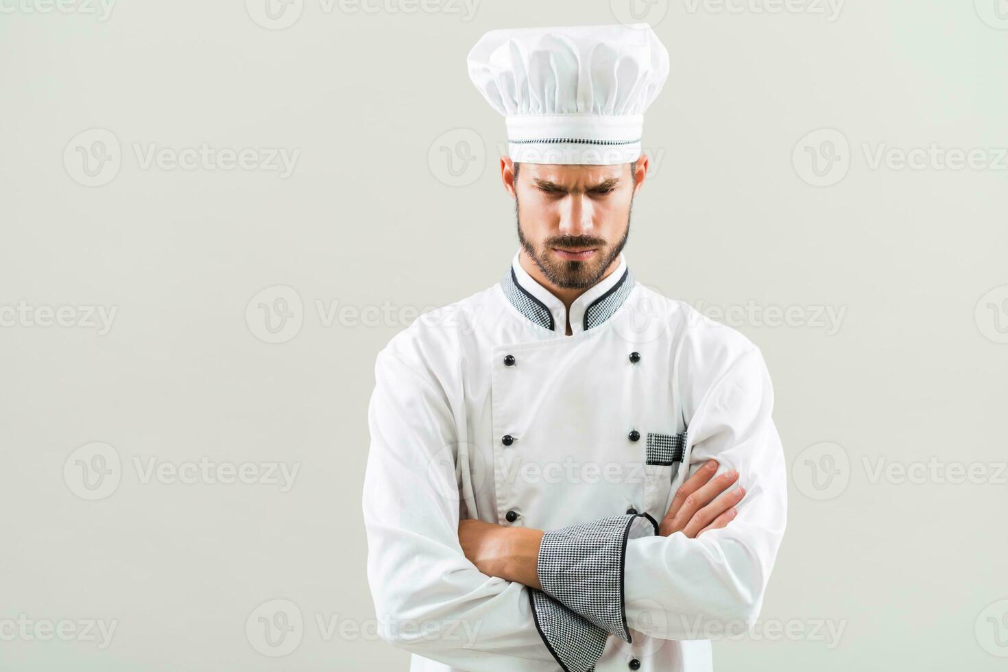 Angry chef on gray background. photo