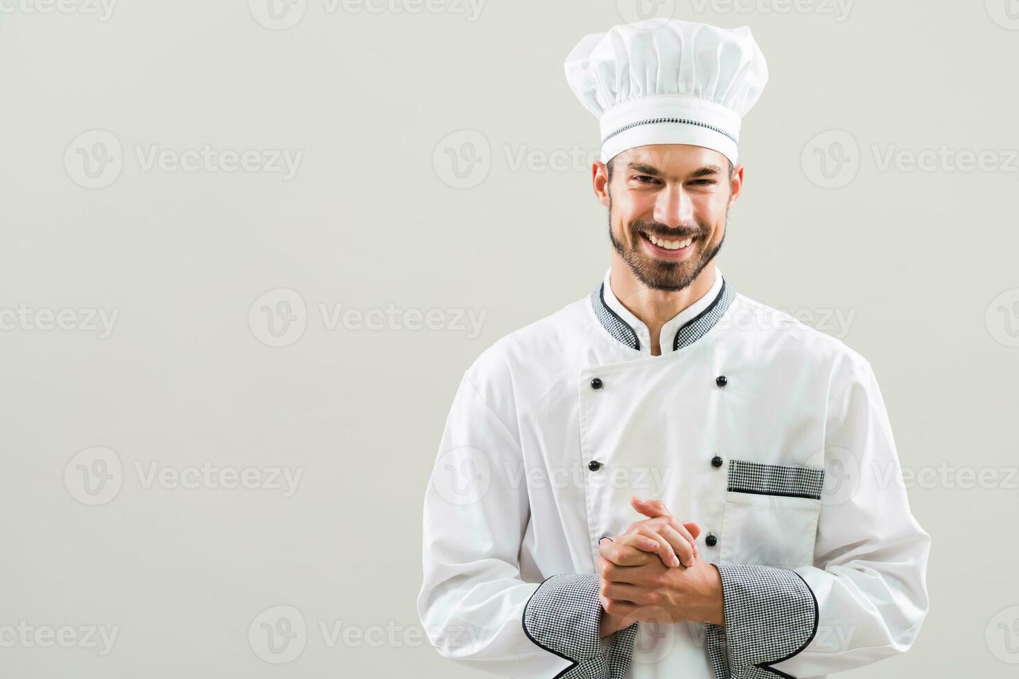Portrait of smiling chef preparing to cook photo