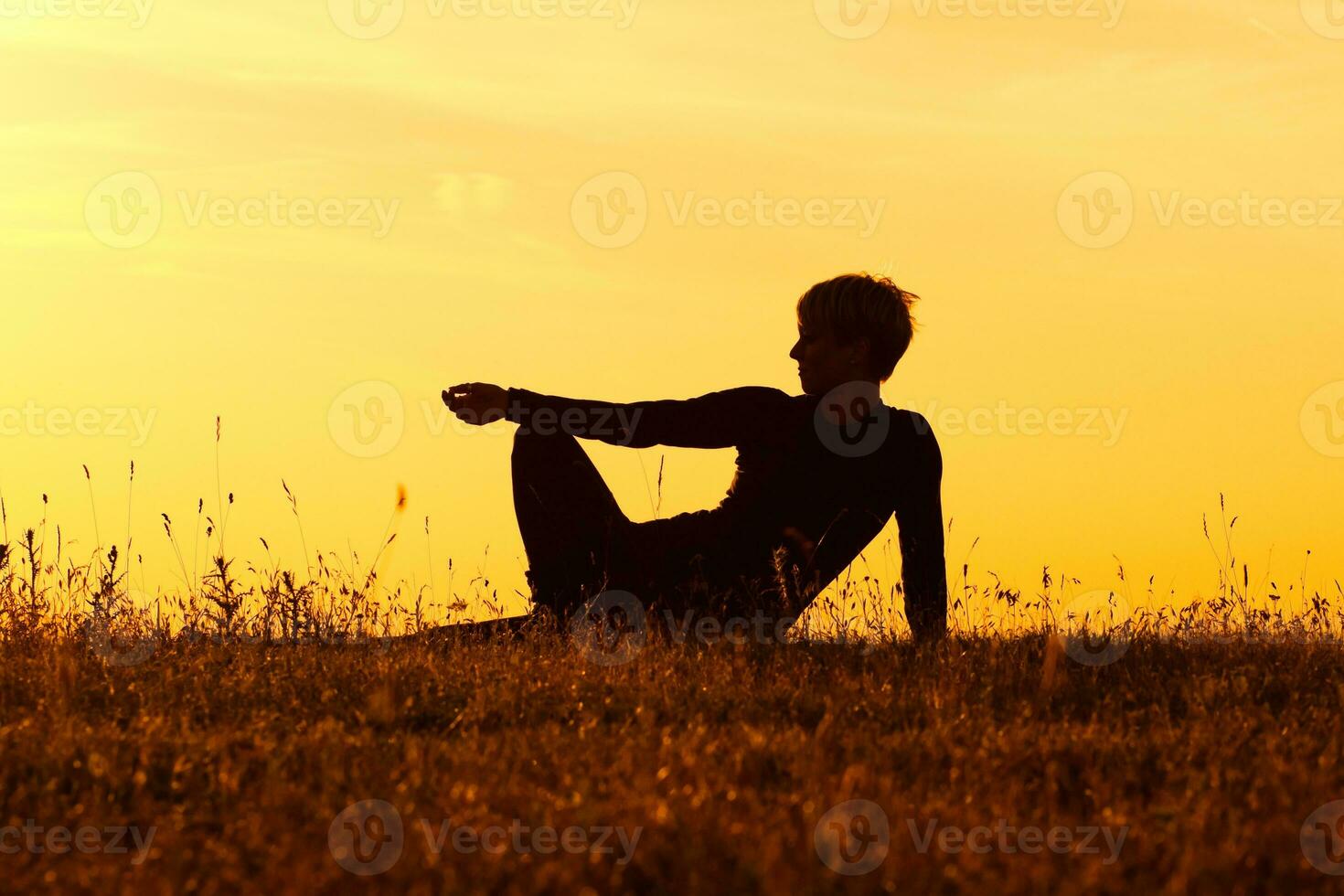 Silhouette of woman enjoying in the nature photo