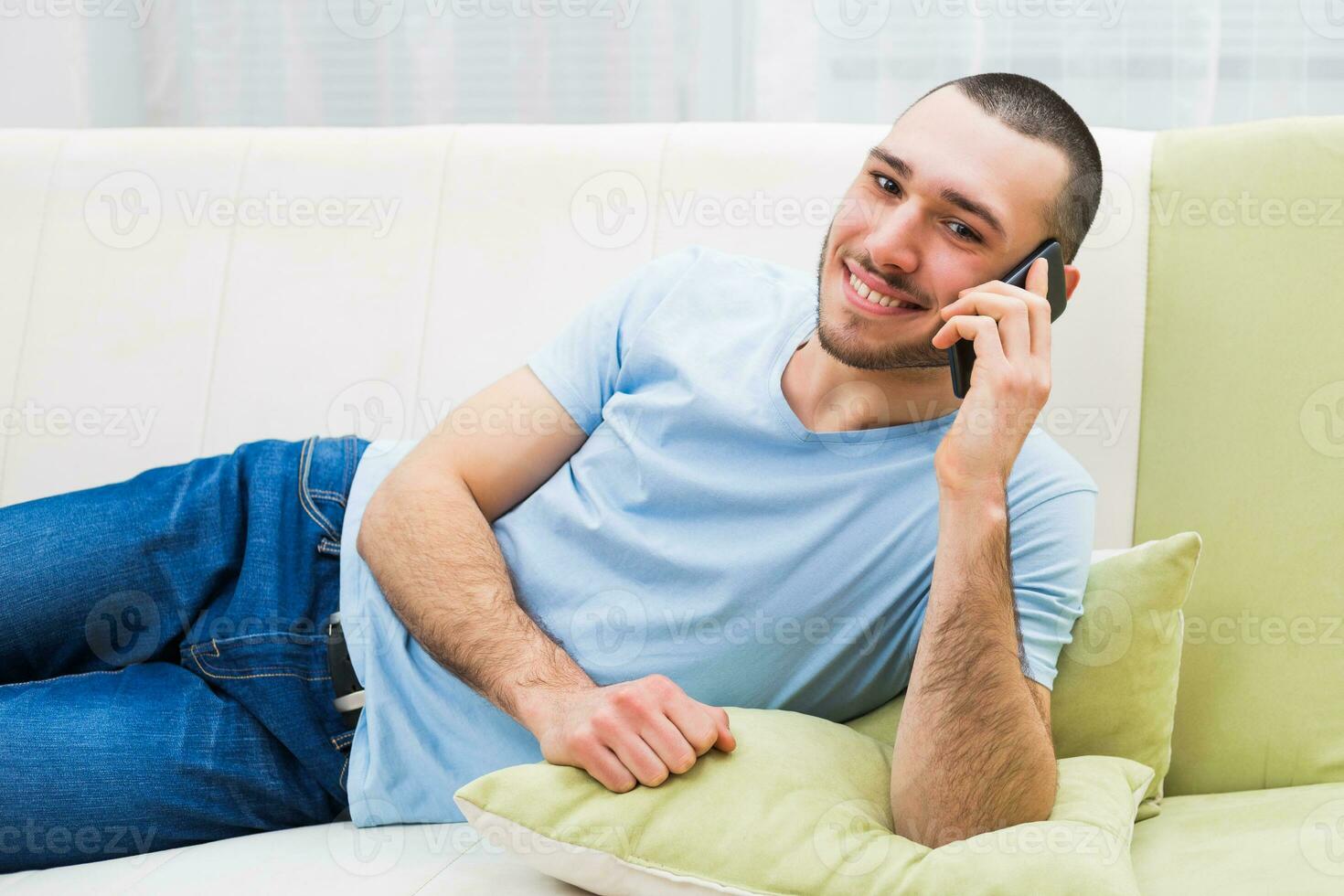 Young man using mobile phone photo