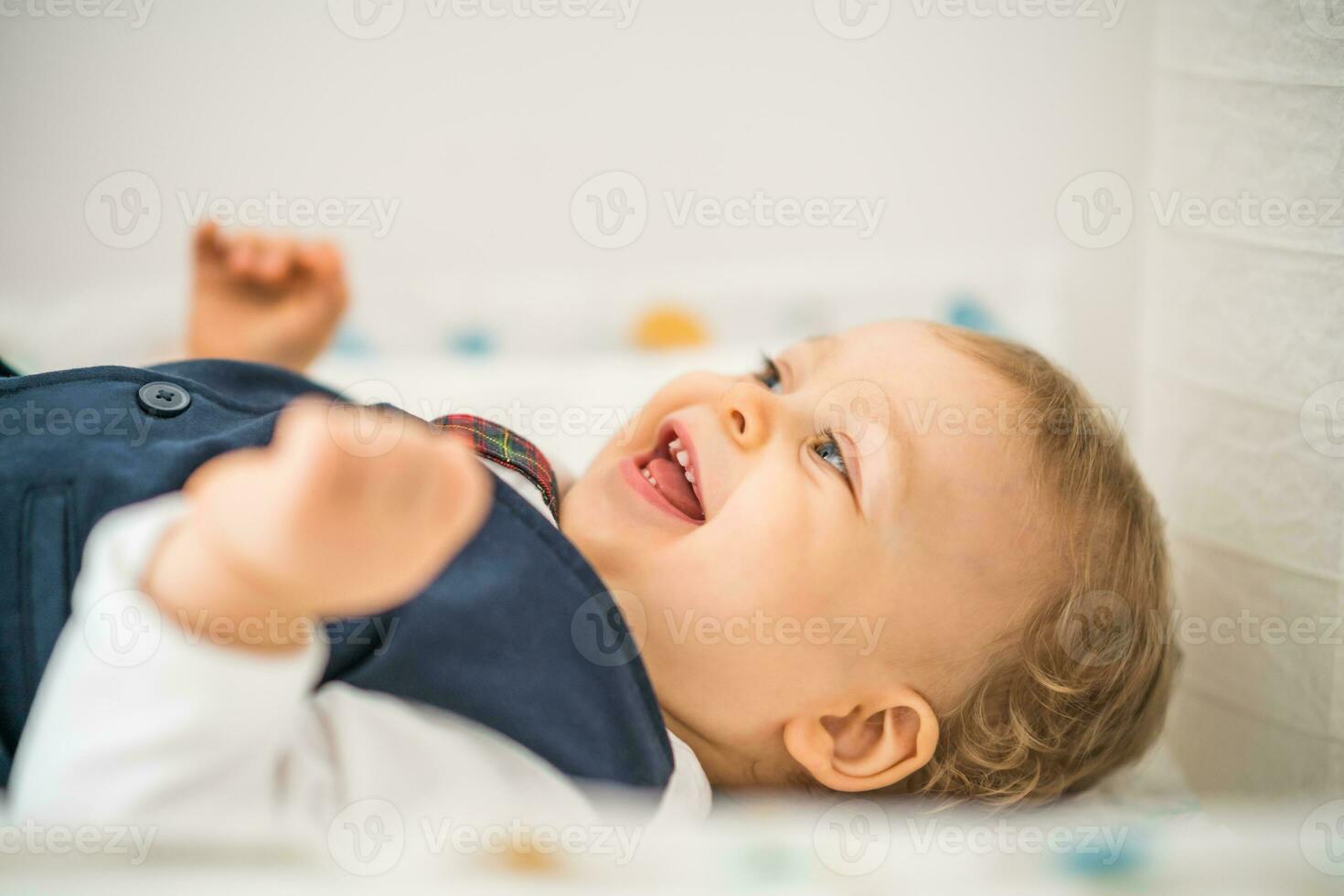 Close up image of cute happy baby boy photo