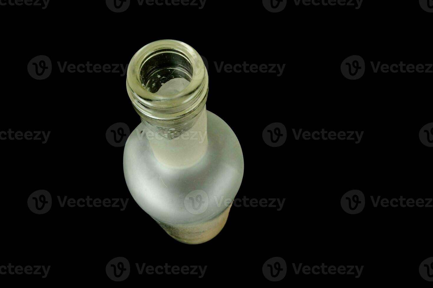 a white bottle on a black background photo