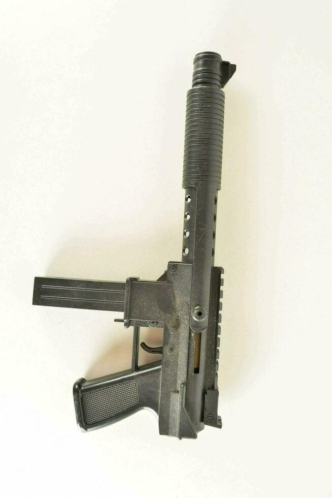 a gun with a black handle and a metal barrel photo