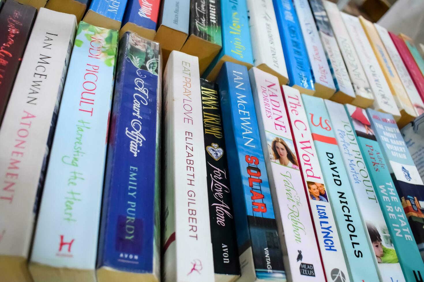 New Delhi, India, September 09 2023 - Variety of Books on shelf inside a book-stall at Delhi International Book Fair, Selection of books on display in Annual Book Fair. photo