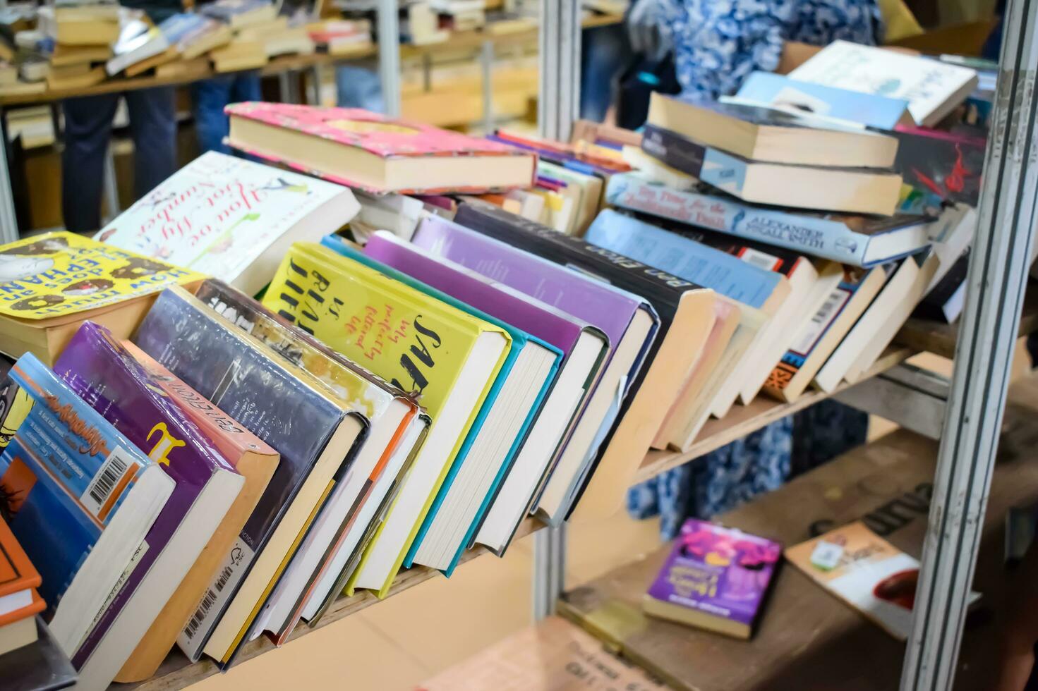 New Delhi, India, September 09 2023 - Variety of Books on shelf inside a book-stall at Delhi International Book Fair, Selection of books on display in Annual Book Fair. photo