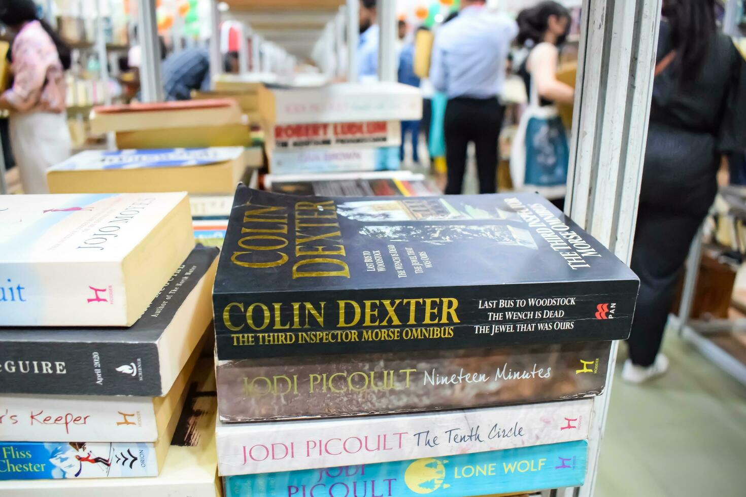 New Delhi, India, September 09 2023 - Variety of Books on shelf inside a book-stall at Delhi International Book Fair, Selection of books on display in Annual Book Fair. photo