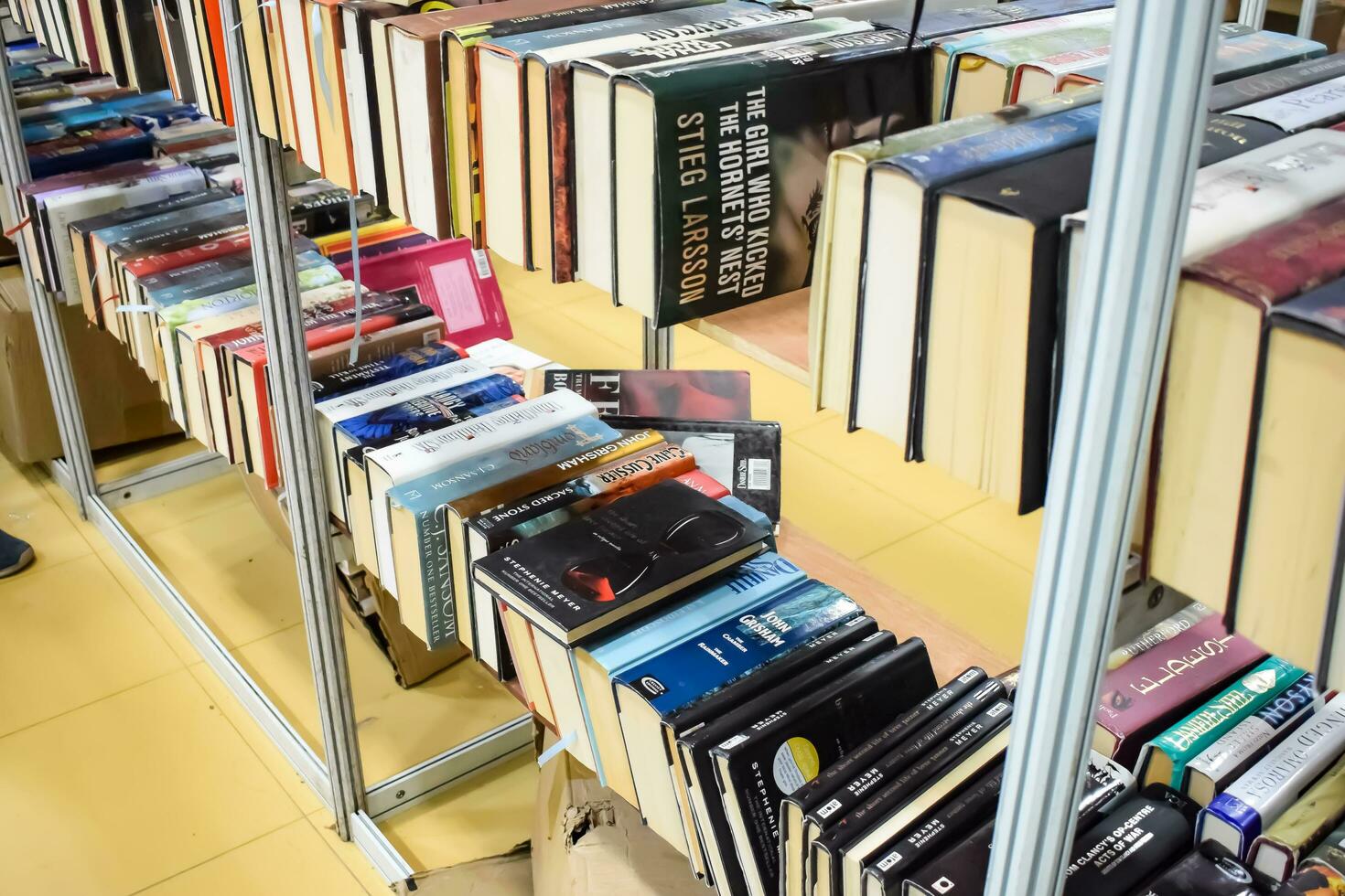 New Delhi, India, September 09 2023 - Variety of Books on shelf inside a book-stall at Delhi International Book Fair, Selection of books on display in Annual Book Fair. photo