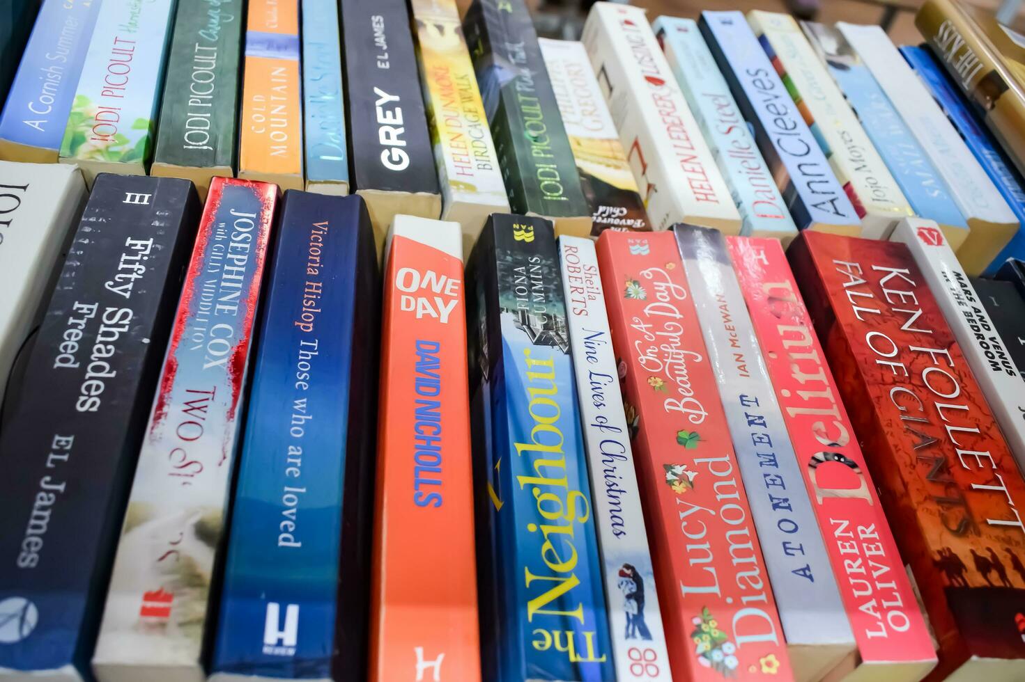 New Delhi, India, September 09 2023 - Variety of Books on shelf inside a book-stall at Delhi International Book Fair, Selection of books on display in Annual Book Fair. photo