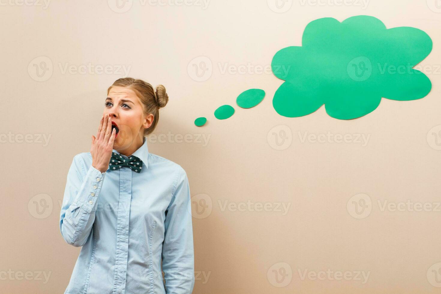 Tired nerdy girl yawning photo