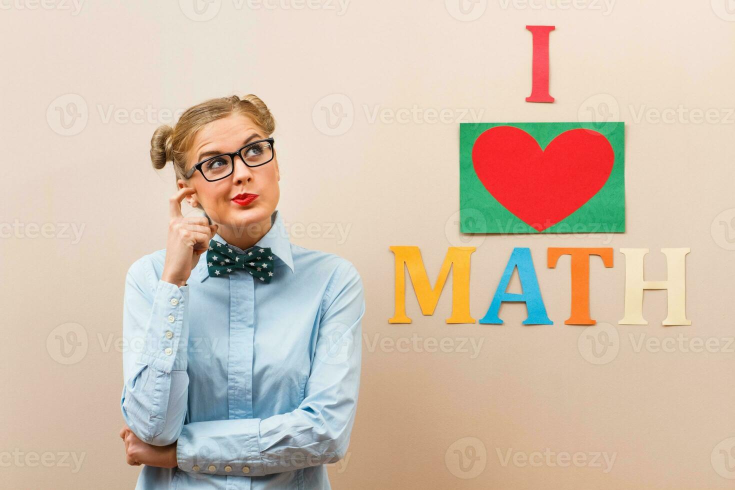Nerdy girl mathematician thinking photo