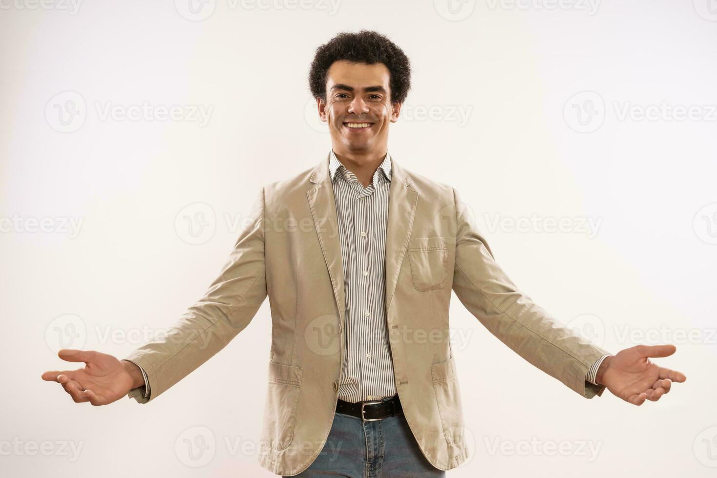 Portrait of happy and successful businessman showing welcome gesture photo