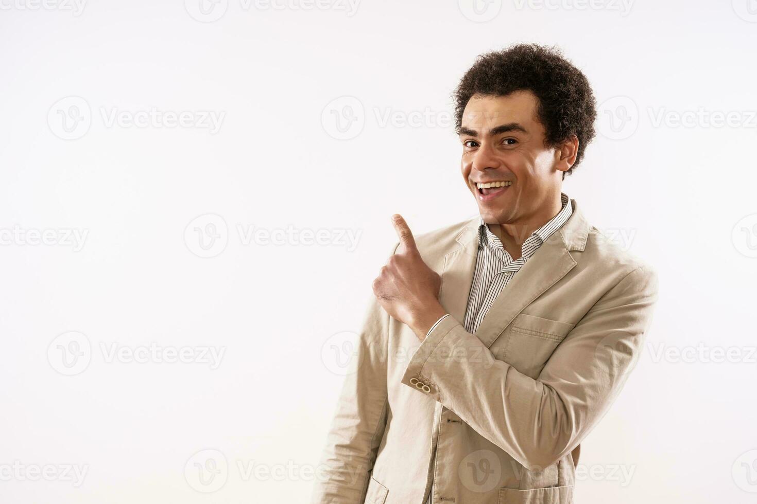 Portrait of happy businessman pointing photo