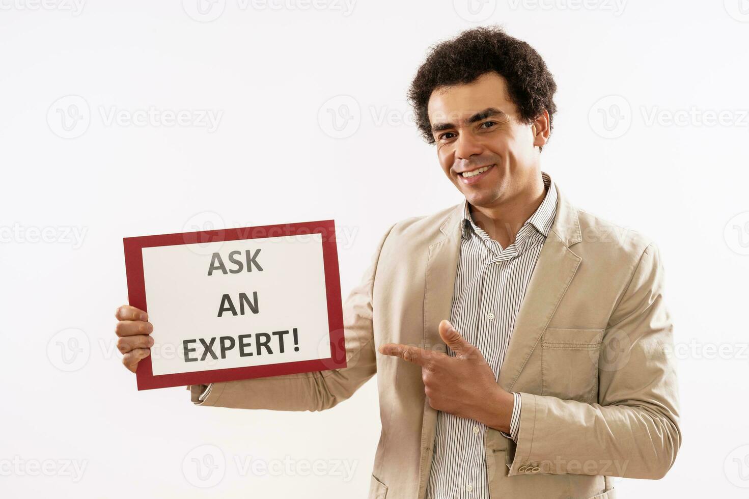 Image of businessman holding paper with text ask an expert photo