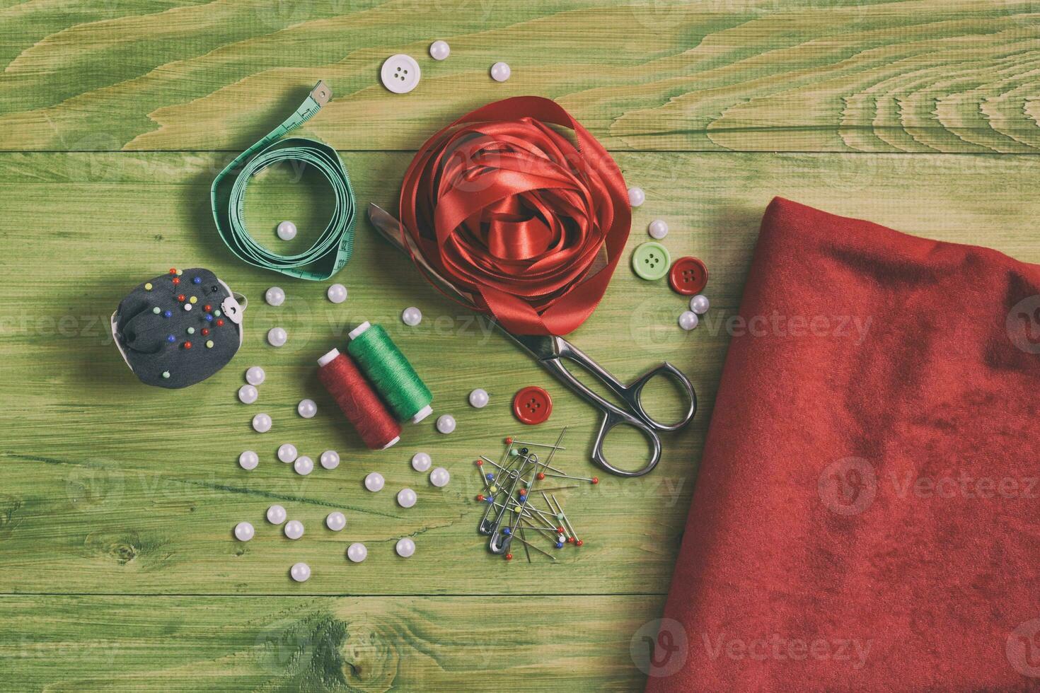Sewing accessories on wooden table photo