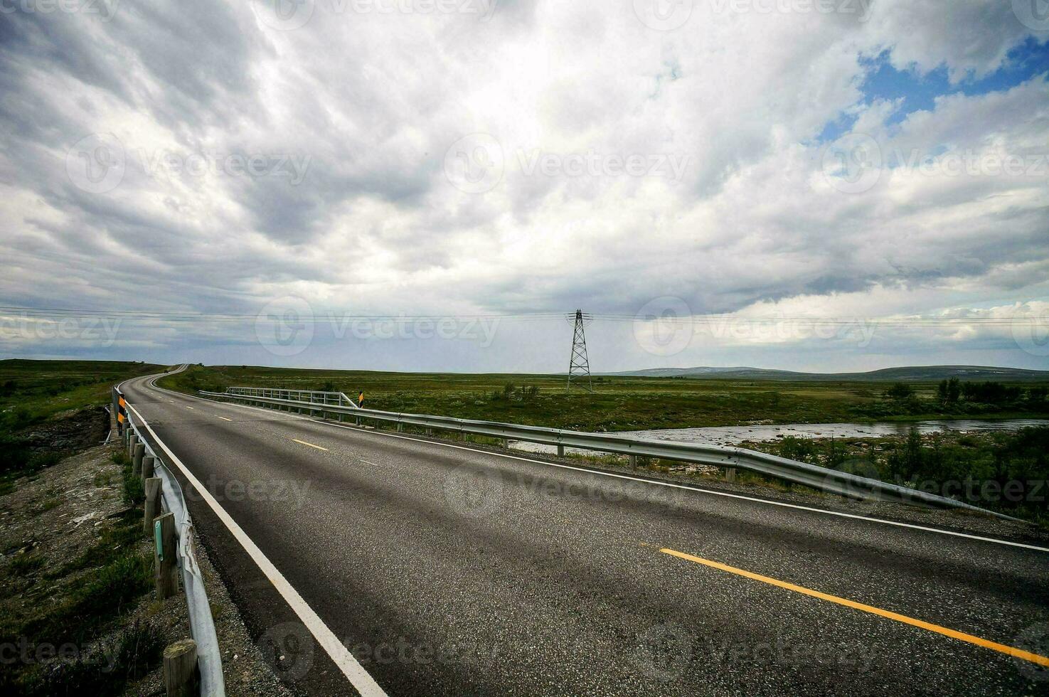 a highway with a bridge photo