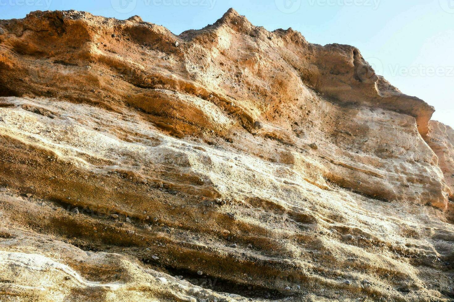 the rock face of a cliff photo