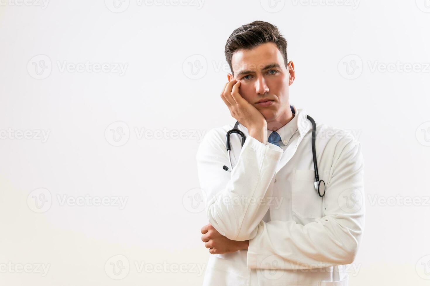 Image of worried and tired doctor thinking photo
