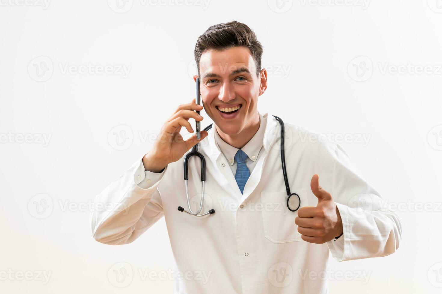 Image of happy doctor talking on the phone and showing thumb up photo