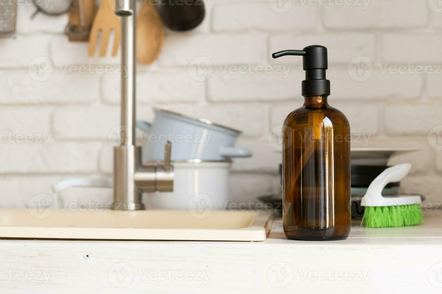 Recycled plastic pump bottle for mockup on white brick wall background near sink photo