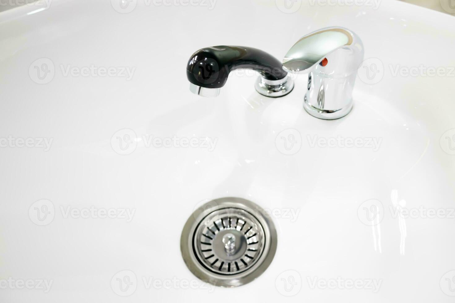 crystal clear hair wash in a beauty salon with black watering. selective focus.High quality photo
