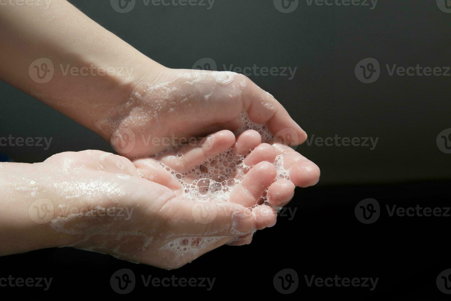 Caucasian woman hands while washing hands with soap . Top view . Hygiene .Cleaning hands . Hygiene concept hand detail coronavirus protective measure photo