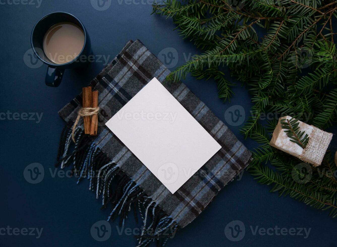 a sheet of paper lies on a table with a scarf and a cup of coffee. photo