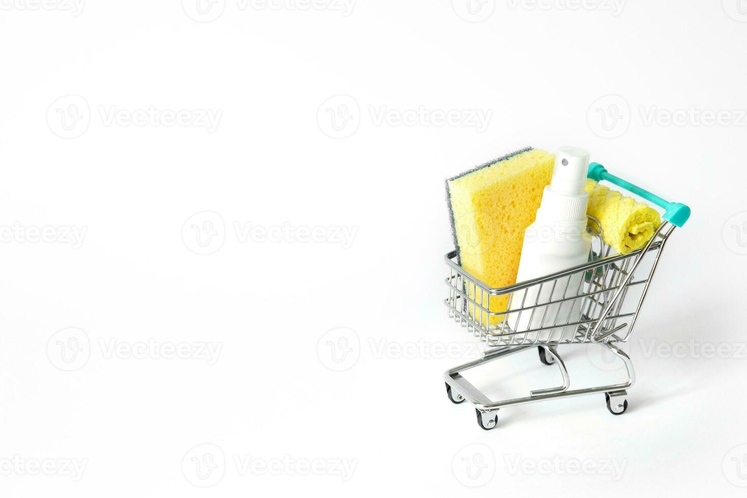 shopping cart with detergents and sponges for dishes. free space for text. High quality photo