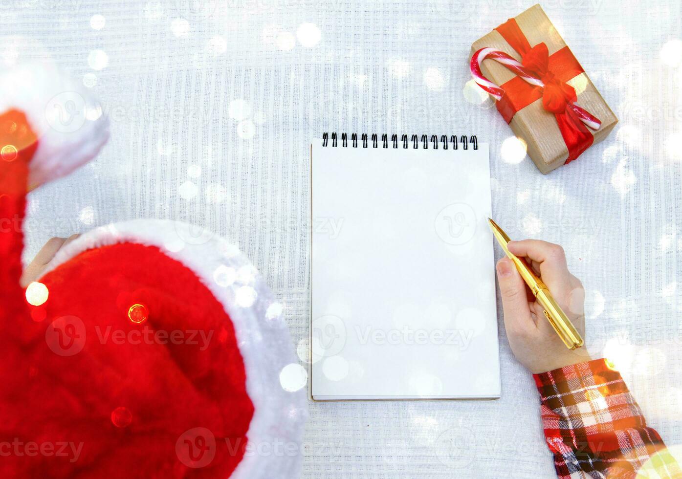 child writes letter to Santa and there is box with gift nearby. selective focus photo