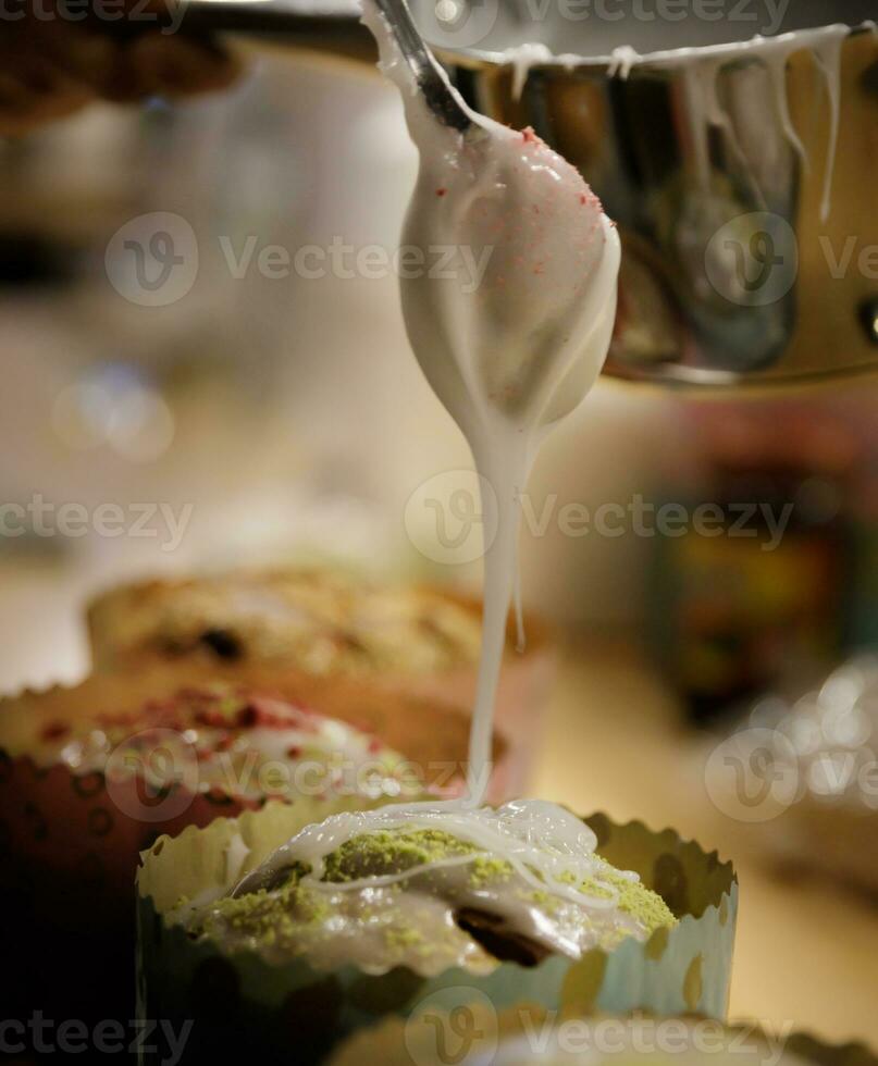 The chef hands adorn the cupcakes with icing sugar and slices of sugar. background blurred, selective focus.High quality photo
