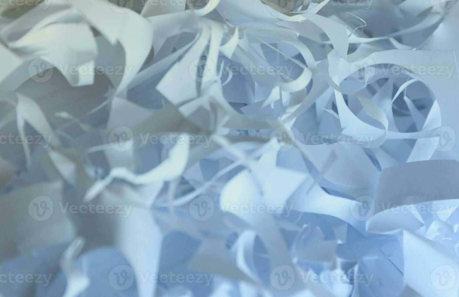 Shredded paper texture background, top view of many white paper strips. Pile of cut paper like box filler for shipping fragile items photo