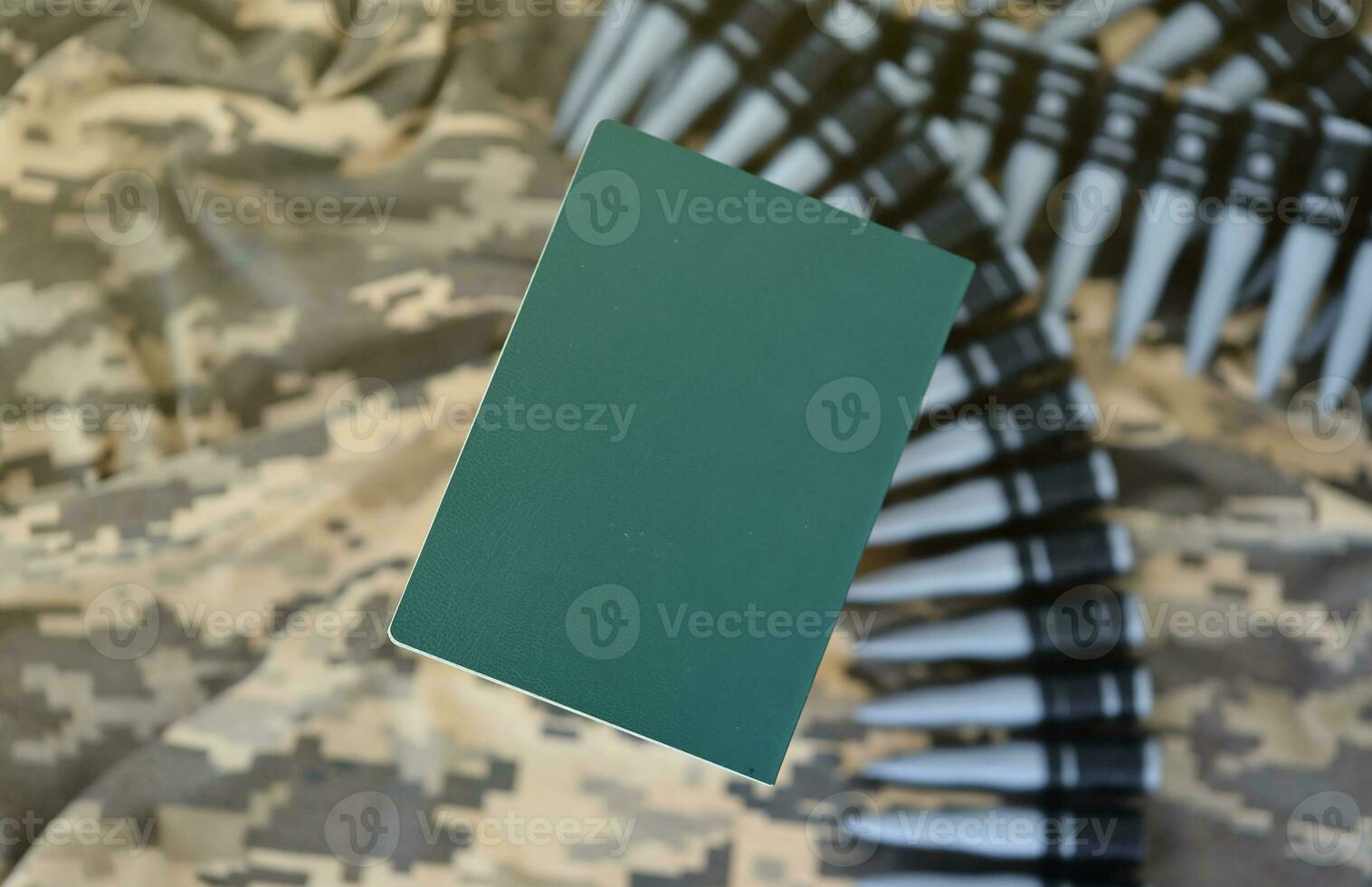 Ukrainian military ID on fabric with texture of pixeled camouflage. Cloth with camo pattern in grey, brown and green pixel shapes with Ukrainian army personal token photo