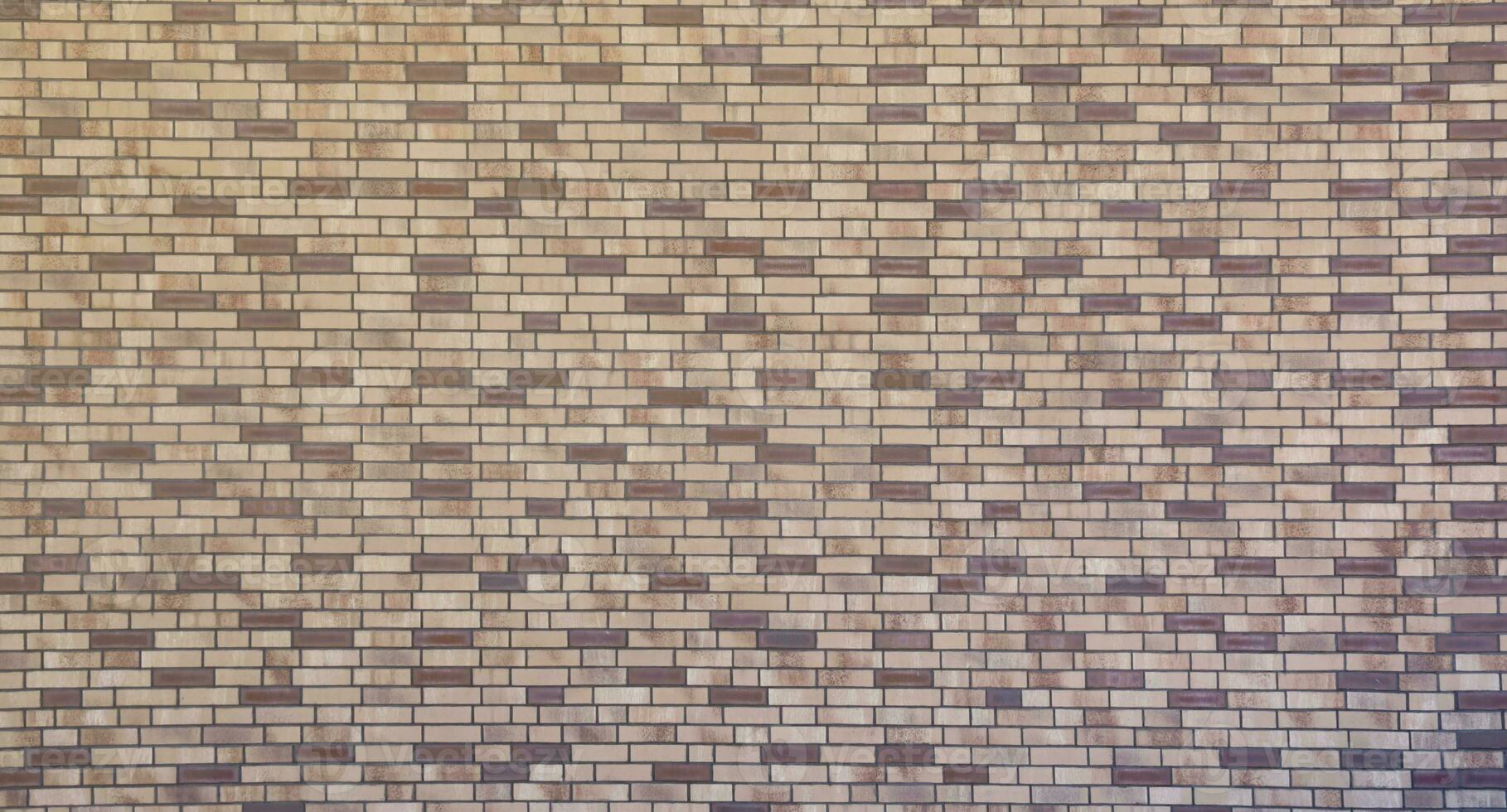 Dark brick wall pattern with chaotic masonry order. Background texture or resource for 3d texturing. Many bricks in big modern stone wall photo