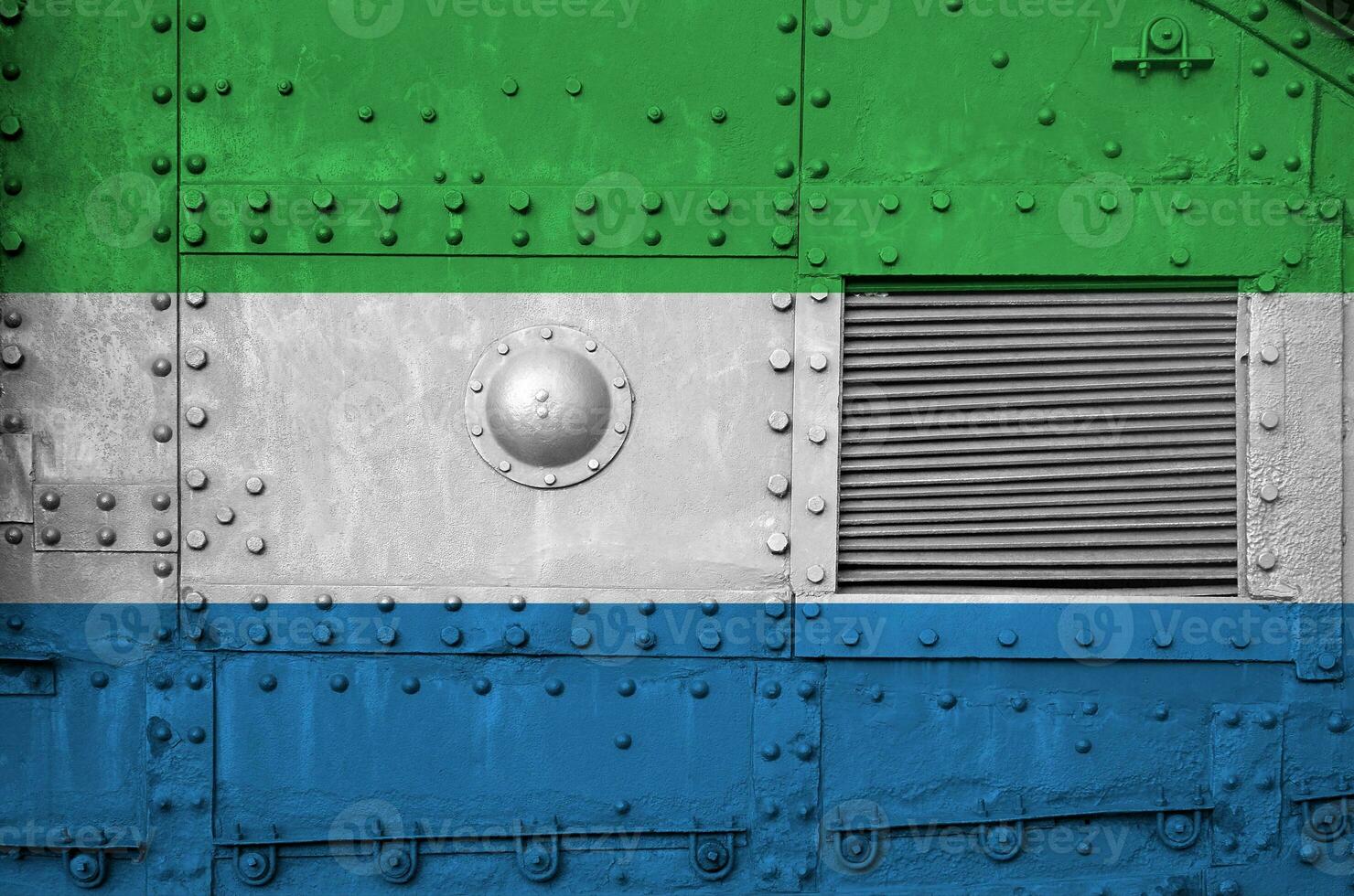 Sierra Leone flag depicted on side part of military armored tank closeup. Army forces conceptual background photo