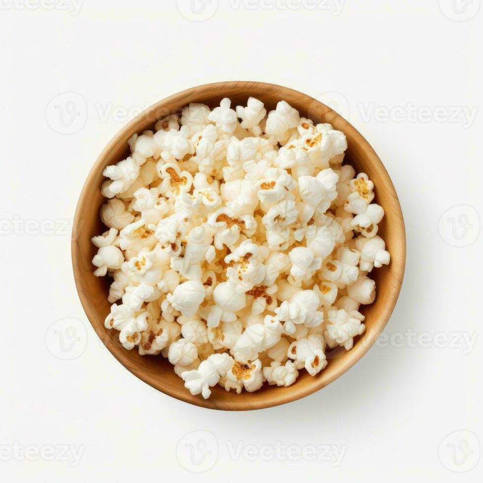 Popcorn in the wooden bowl, isolated on white background, top view. Generative ai photo