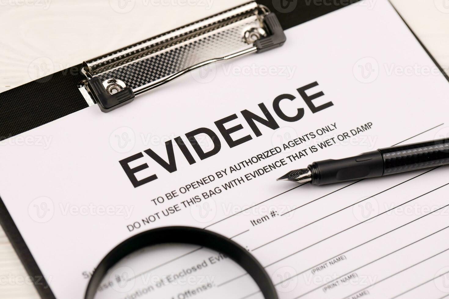 Evidence report blank on A4 tablet lies on office table with pen and magnifying glass photo
