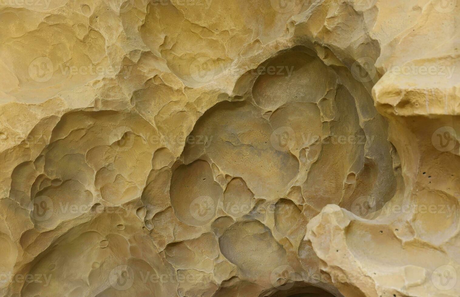 Combination of stone relief like a orange planet surface. Brown stone with abnormal relief shape photo