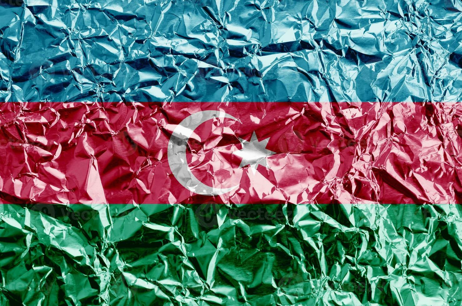 Azerbaijan flag depicted in paint colors on shiny crumpled aluminium foil closeup. Textured banner on rough background photo