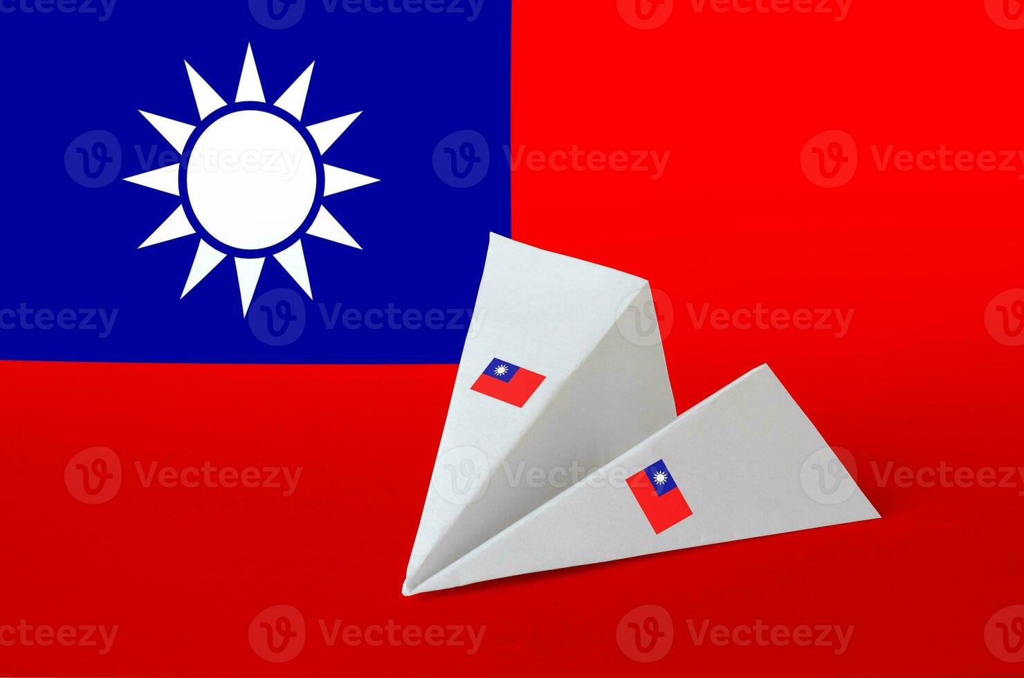 Taiwan flag depicted on paper origami airplane. Handmade arts concept photo