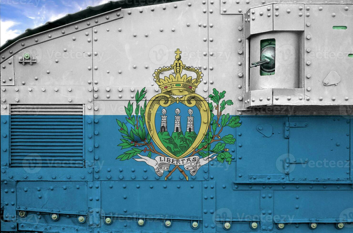 San Marino flag depicted on side part of military armored tank closeup. Army forces conceptual background photo